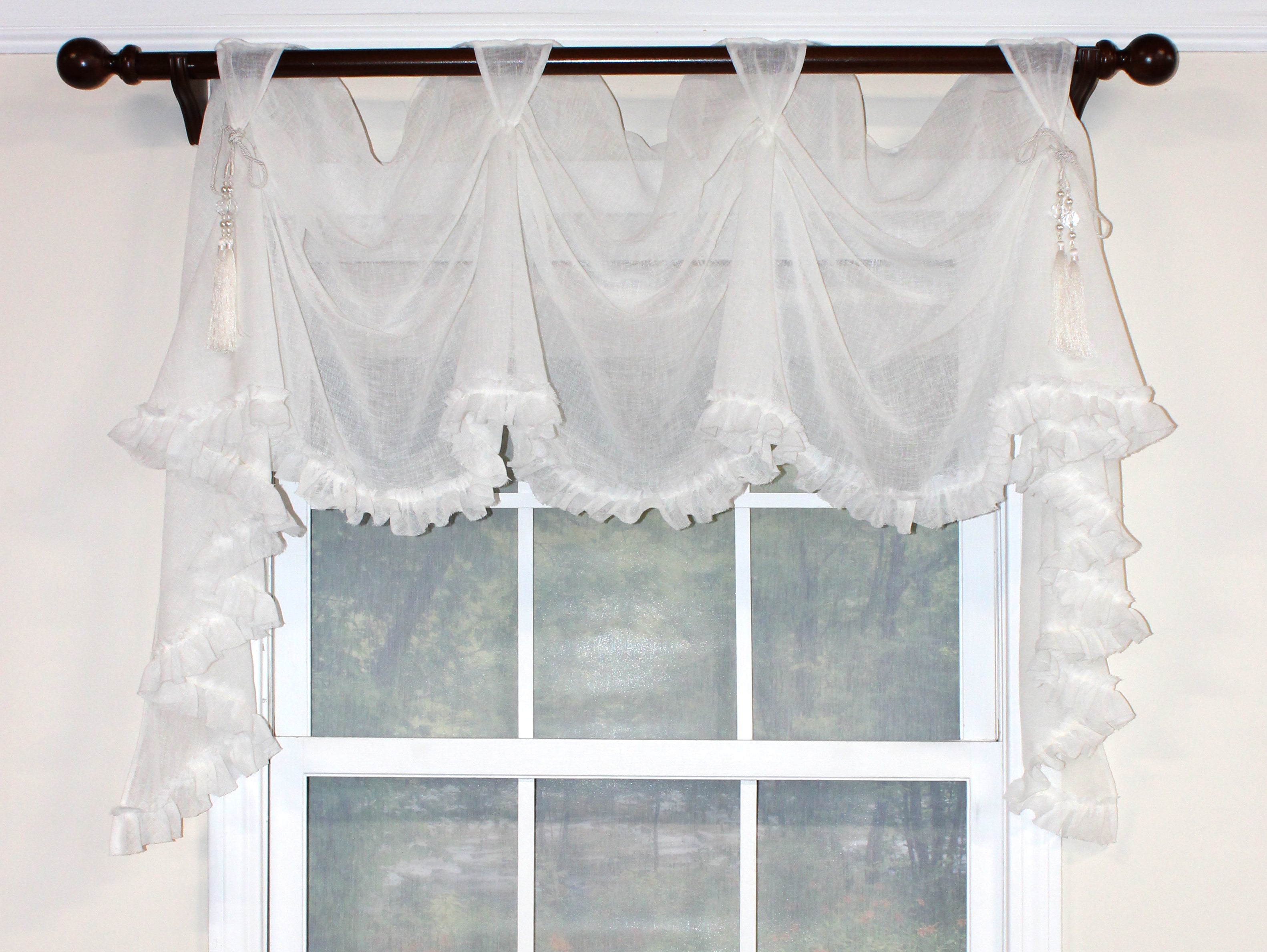 Our Breezy Victory Swag Valance is so shabby chic with its ruffled unfinished edge and optional beaded chair-tie accents. This semi-sheer cotton fabric in the color Cloud, creates a free-flowing and elegant look. Pair with our Breezy Rod Pocket Panels beneath for a heavenly appeal!