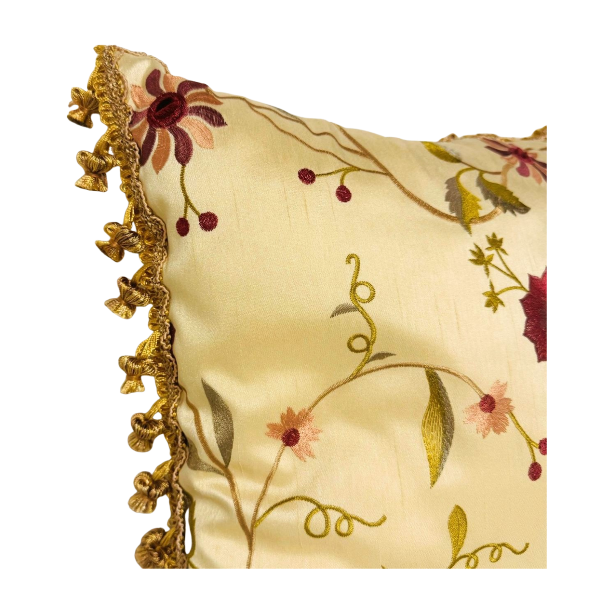 Decorative pillow with floral embroidery and gold tassels on a gold background. Holiday throw pillow
