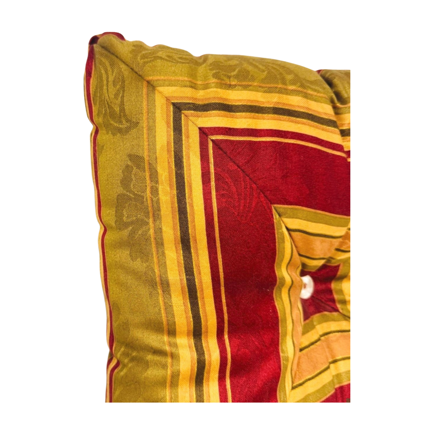 Decorative pillow with red and yellow pattern on a white background