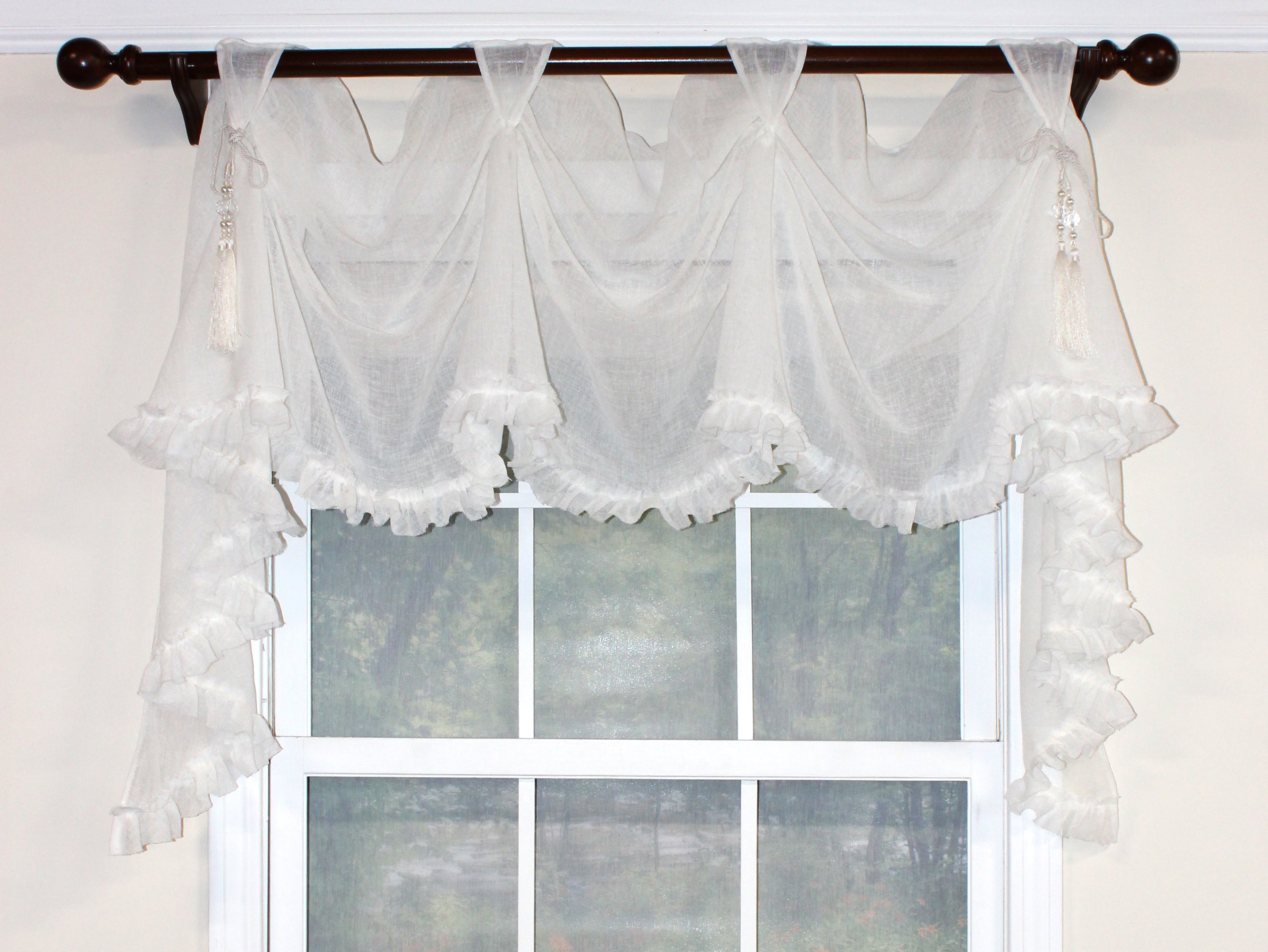 Our Breezy Victory Swag Valance is so shabby chic with its ruffled unfinished edge and optional beaded chair-tie accents. This semi-sheer cotton fabric in the color Cloud, creates a free-flowing and elegant look. Pair with our Breezy Rod Pocket Panels beneath for a heavenly appeal! 